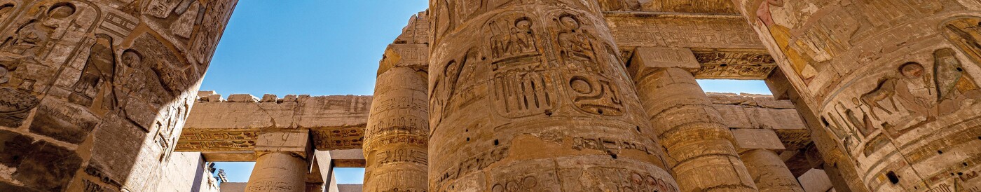 The Karnak Temple Complex a collection of ancient temples, chapels and various other buildings, with ram headed sphinx at the entrance and 134 pillars with hieroglyphs and paintings at the Great Hypostyle Hall at Luxor, a capital of ancient Upper Egypt kn