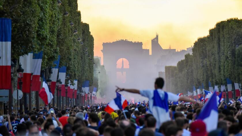 PARIS, France ? July 15, 2018 : thousands of jubilant french fans on the Avenue des Champs-Elysees celebrating France's victory over Croatia in the 20