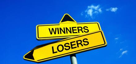 Winners or Losers - Traffic sign with two options - Competitive motivation to be successful and not lose game, match, play, duel and competition