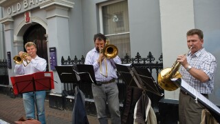 St Petersberg Brass Baroque Quartet busking on the street during Abergavenny Food Festival Monmouthshire South Wales UK