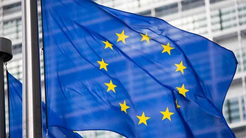 EU flags flying in front of a building