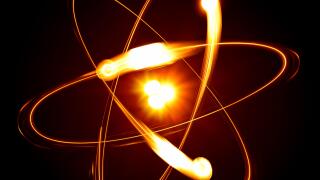 Symbol of atom over black background