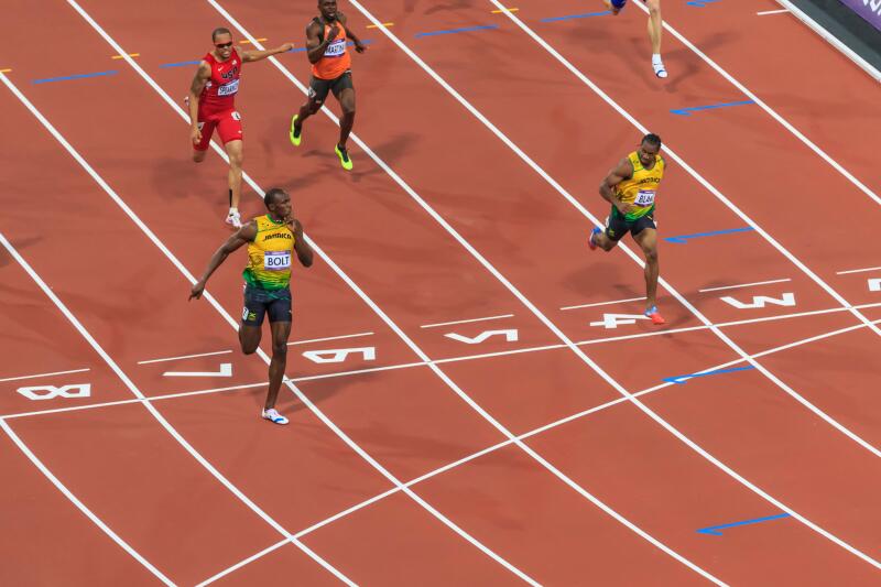 Usain Bolt crosses line with finger to lips, looks at Yohan Blake, Men's 200m final, London 2012, Olympic Games, London, UK