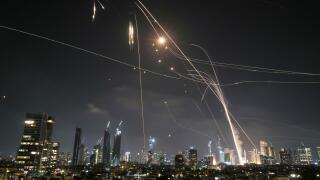 Israeli Iron Dome air defense system fires to intercept missiles over Tel Aviv, Israel, Friday, June 13, 2025. (AP Photo/Leo Correa)
