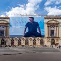 Advertising billboard for the Beckham - Boss clothing collection, by Hugo Boss, over the restoration works on the main facade of the Paris Opera house