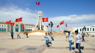 Tunisia, Tunis, boys playing football in the Town Hall square