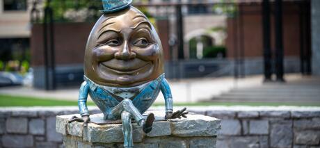 Humpty Dumpty statue sitting on wall in Suwanee Town Square, Suwanee, Georgia