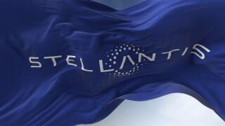 Amsterdam, Holland, March 2022: Close-up view of the blue flag with the Stellantis logo waving in the wind. Stellantis is a Dutch multinational motor