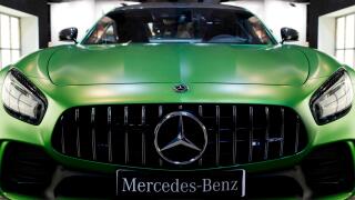 Front view of a green Mercedes-Benz AMG GT Coupe.