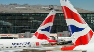 London, England, UK - 20 May 2025: Tail fins of British Airways jets in front of Terminal 5 at London Heathrow Airport