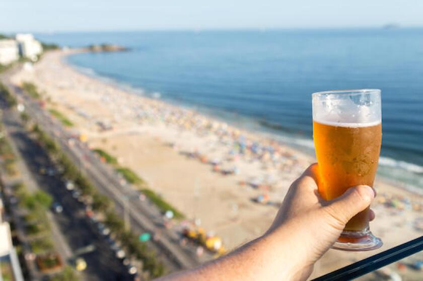 Beer with Rio de Janeiro, Brazil beach background