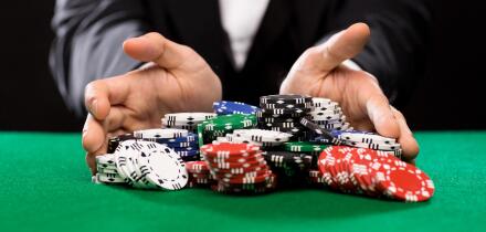 poker player with chips at casino table