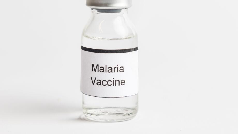 A Medical Vial with a label reading Malaria Vaccine