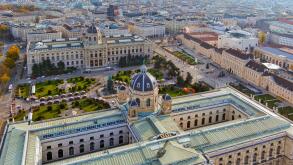 A magnificent aerial shot of Vienna?s MuseumsQuartier, featuring the Kunsthistorisches Museum and lush gardens, showcasing architectural brilliance an