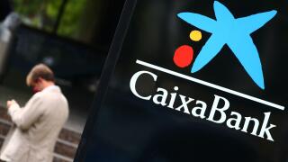 The logo of Caixabank is seen outside a branch in Madrid, Spain, September 16, 2020. REUTERS/Sergio Perez