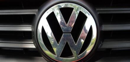 VW Logo on a red Volkswagen car