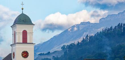 Church tower and mountains in Mauren, Liechtenstein