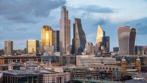 Sun Setting on The City of London, City of London Skyline, River Thames, London, England, UK, GB.