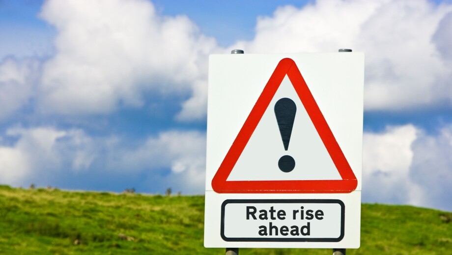 Financial concept warning of interest rates rise ahead sign England UK