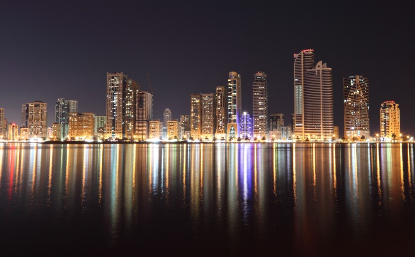 Skyline of Sharjah City at night, United Arab Emirates