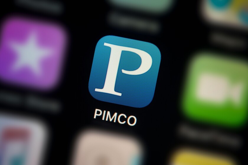 A close-up shot of the Pimco app icon, as seen on the screen of a smart phone (Editorial use only)