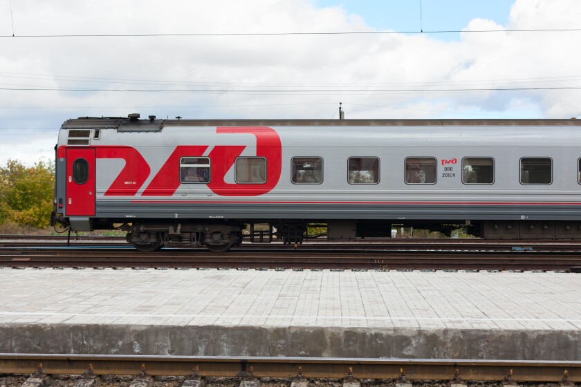 Russian train carriage. Logo of Russian Railways (RZhD). Third-class sleeper wagon