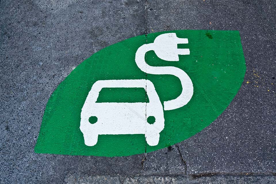 Electric car sign, charging station, green sign painted on street