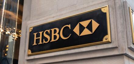 HSBC logo on a wall in New York. HSBC Holdings is a British multinational banking and financial services company headquartered in London, United Kingd