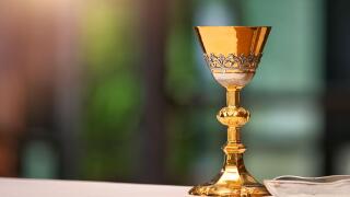 Chalice on the altar in church and empty space for text