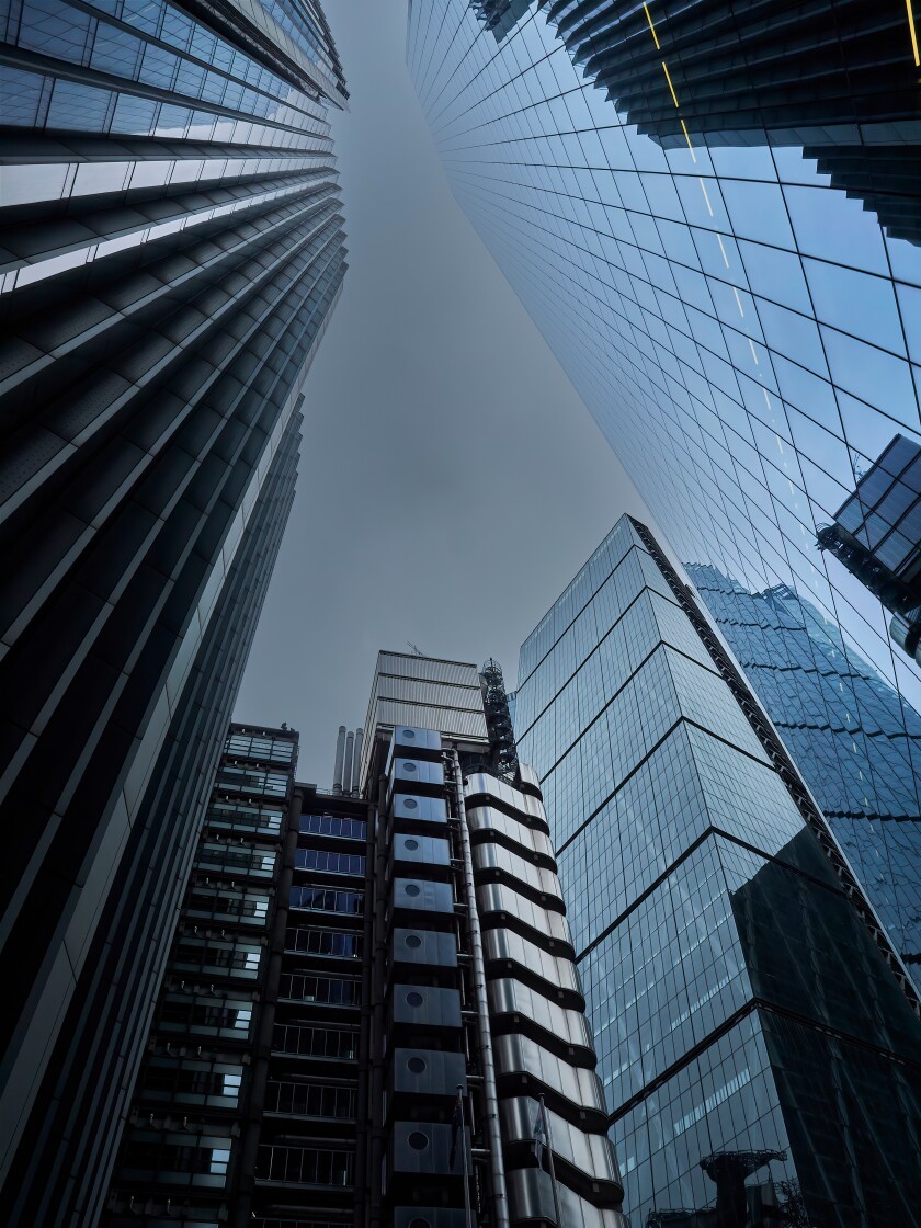 Low-key, geometric image, showing a scrap of overcast sky almost