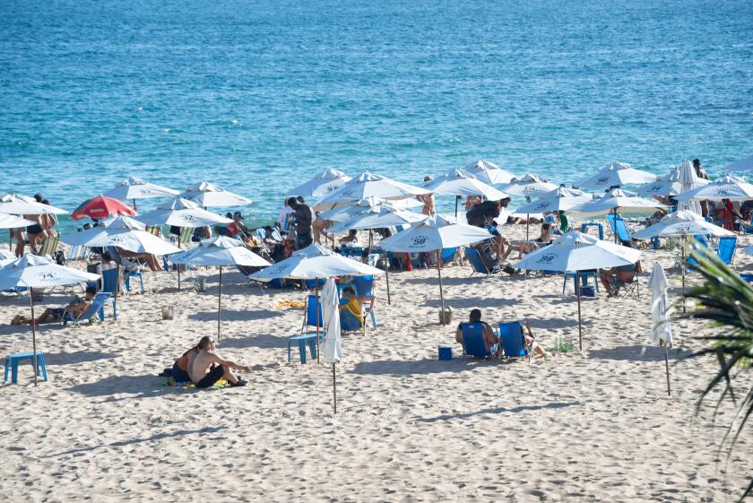 Salvador, Bahia, Brazil - January 24, 2025: Hundreds of people are seen on Paciencia beach sunbathing in the city of Salvador, Bahia.