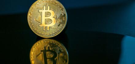 Bitcoin coin or cryptocurrency on dark background, concept financial picture