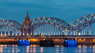 Night river with bridge and reflection in Riga