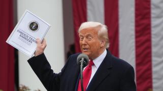 United States President Donald J Trump holds a report on ?Foreign Trade Barriers? as he makes remarks during a ?Make America Wealthy Again? event in the Rose Garden of the White House in Washington, DC on Wednesday, April 2, 2025. The President has called