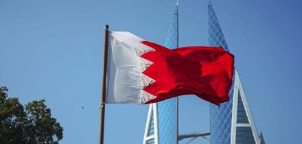 The national flag of Bahrain and Bahrain World Trade Centre.f