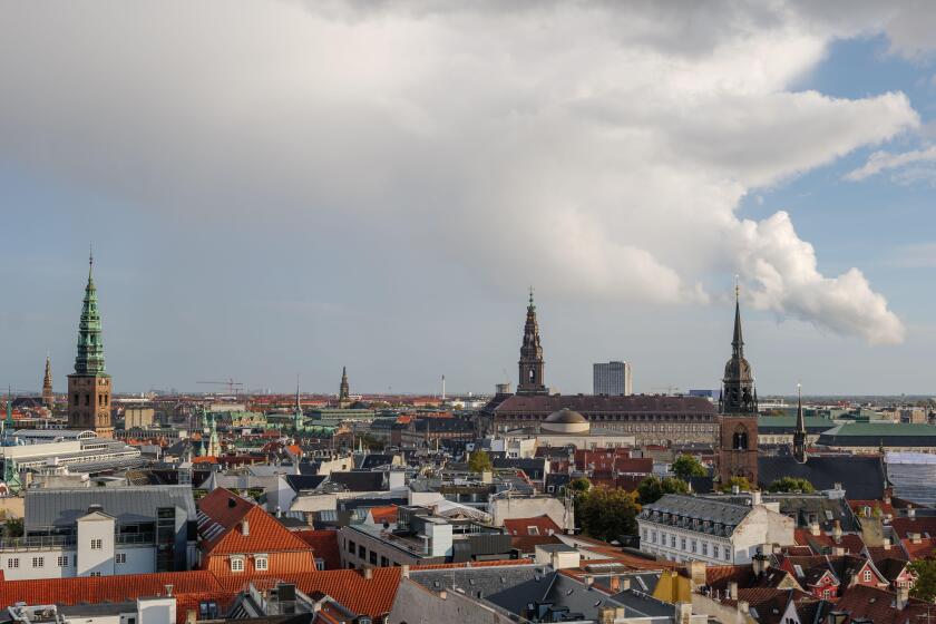 Aerial panoramic outdoor scenery view over Copenhagen, Denmark after raining with background of rainbow.