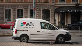 Picture of a sign with the logo of Elis on a vehicle of the firm in Riga. Elis is a French company, founded in 1969 and specialized in the field of cl