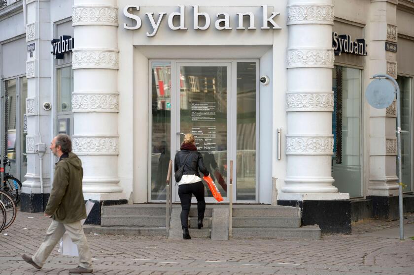 The entrance of Danish finance institute Sydbank is pictured in Copenhagen, November 5, 2013. REUTERS/Fabian Bimmer (DENMARK - Tags: BUSINESS)