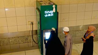 Mecca, Saudi Arabia, June 23 2024:  Pilgrims using SNB ATM to withdraw cash money, Saudi National Bank SNB AlAhli formerly The National Commercial Ban