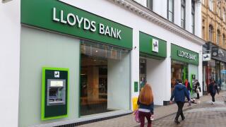 LEEDS, UK - JULY 11, 2016: People walk by Lloyds Bank in Leeds, UK. Lloyds Bank is a public limited company and is one of biggest banks in the UK.