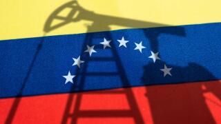 The oil industry of venezuela . Oil rigs on the background of the venezuelan flag. Mining and oil export. trading on global fuel market. Fuel industry