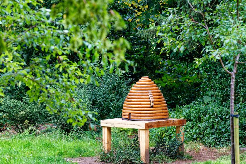 Wooden model bee hive in the grounds of Marble Hill House, Twickenham, London