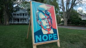 Lexington, Massachusetts, USA.  13th July, 2016.  A Lexington, MA, democrat made a 3 foot by 5 foot poster protesting the Republican Presidential candidate, Donald Trump, mounted it on a homemade wooden easel and placed it in his front yard on Massachuset