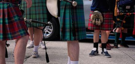 Scotland soccer fans with bagpipes wear kilts as they wait to enter the stadium for a Miami Marlins against the Texas Rangers baseball game after marching with the Tartan Army, Monday, June 22, 2026, in Miami. (AP Photo/Rebecca Blackwell)