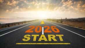 Concept for the start of the new year 2026. The word 2026 written on the asphalt road at sunrise. New calendar year change and anniversary concept