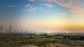 High voltage electric tower on sunrise time near Al Hofuf - Saudi Arabia.