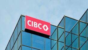 Canadian Imperial Bank of Canada sign mounted on the top floor outside a building.