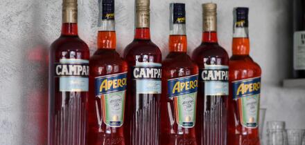 Cremona, Italy July 19th 2025 Several bottles of Campari and Aperol, two famous italian aperitifs, are standing on a bar shelf, ready to be served