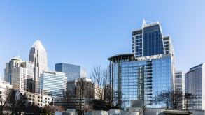 CHARLOTTE, NC, USA-26 JAN 2020: The Charlotte skyline from  Bearden Park in winter, includes  Bank of America Corporate Tower, and the Barings Tower.