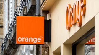 Orange shop sign in Bayonne, France